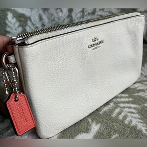 Coach White Pebbled Leather Wristlet with Coral Tag